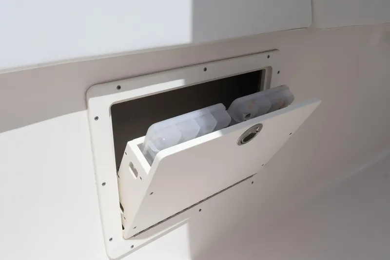 Slide: The Image of Storage compartment on a 2020 Robalo R272 Center Console boat. - 36