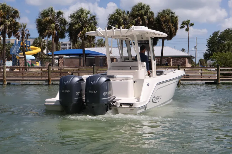 Slide: The Image of 2020 Robalo R272 Center Console boat with twin Yamaha engines on a sunny day. - 4