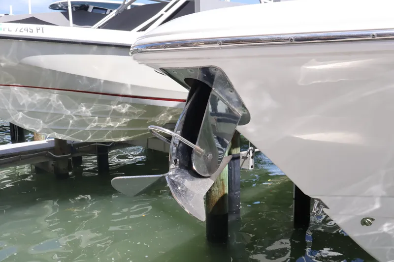 Slide: The Image of 2020 Robalo R272 Center Console boat with stainless steel anchor in marina. - 7