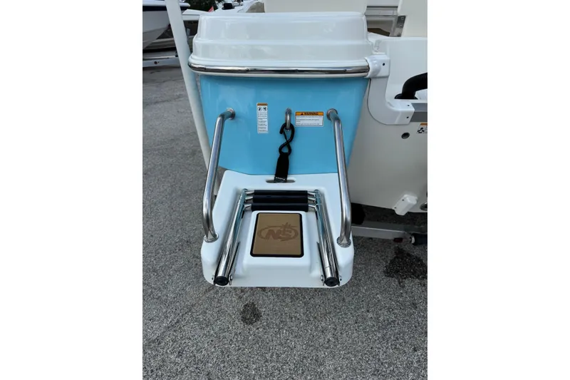 Slide: The Image of 2020 NauticStar 231 Hybrid boat ladder and platform, featuring stainless steel rails. - 12