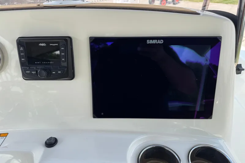 Slide: The Image of 2020 NauticStar 231 Hybrid dashboard with Simrad display and Wet Sounds audio system. - 22