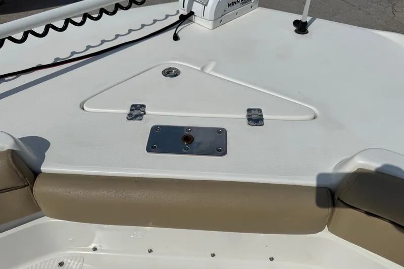 Slide: The Image of 2020 NauticStar 231 Hybrid boat deck with seating and Minn Kota trolling motor. - 25