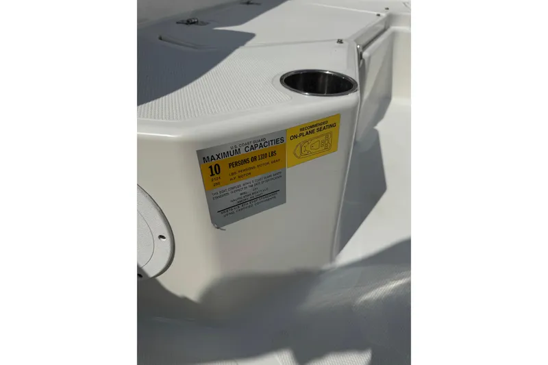Slide: The Image of 2020 NauticStar 231 Hybrid boat capacity label, indicating a maximum of 10 persons or 1310 lbs. - 34