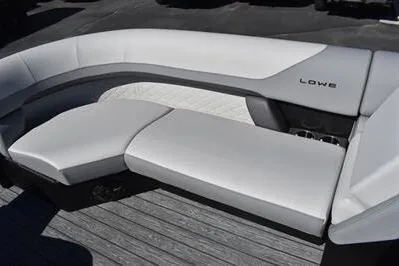 Slide: The Image of 2026 Lowe SF 232 Sport Fish boat with sleek white seating and modern design. - 14