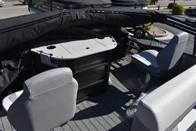 Slide: The Image of 2026 Lowe SF 232 Sport Fish boat interior with seating and table setup. - 22