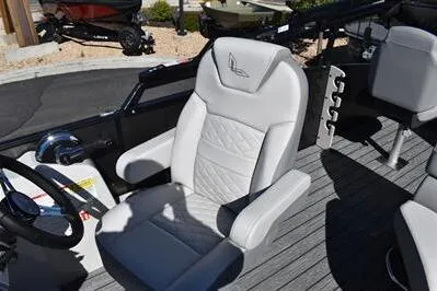 Slide: The Image of 2026 Lowe SF 232 Sport Fish boat interior with plush seating and modern design. - 27