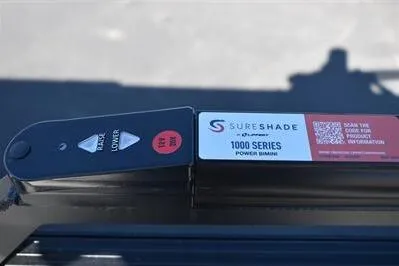 Slide: The Image of SureShade 1000 Series power bimini control on 2026 Lowe SF 232 Sport Fish boat. - 32