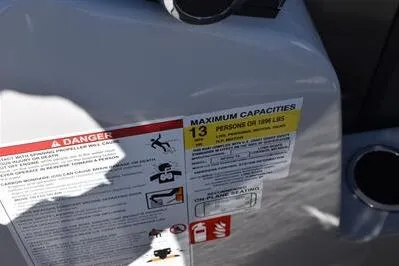 Slide: The Image of Capacity label on 2026 Lowe SF 232 Sport Fish, indicating 13-person limit. - 34