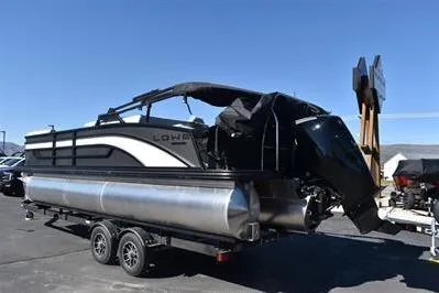 Slide: The Image of 2026 Lowe SF 232 Sport Fish pontoon boat on trailer, parked outdoors. - 8