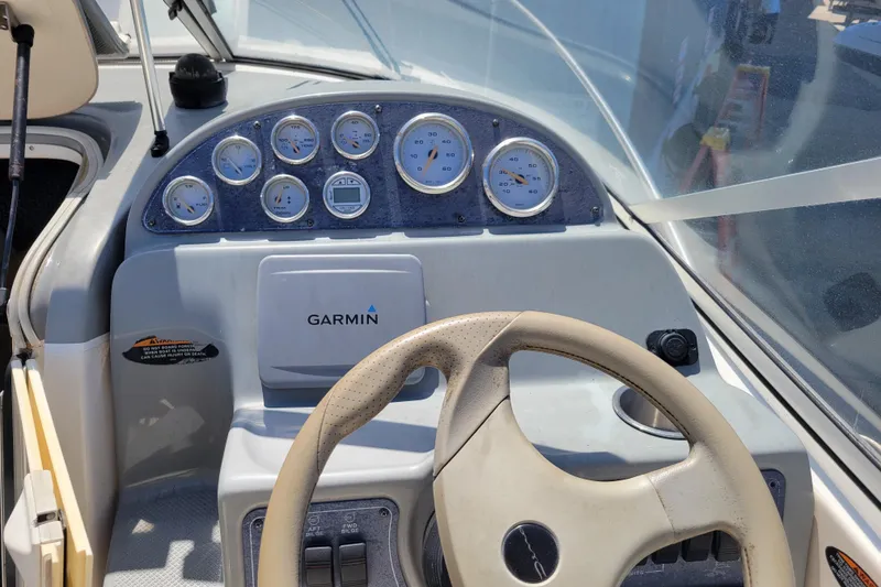 Slide: The Image of Dashboard of a 2003 Bayliner 245 boat with Garmin navigation system. - 5