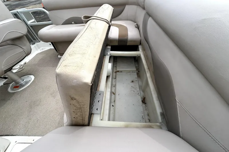 Slide: The Image of 2014 Hurricane FunDeck 226F boat interior with open storage compartment. - 13