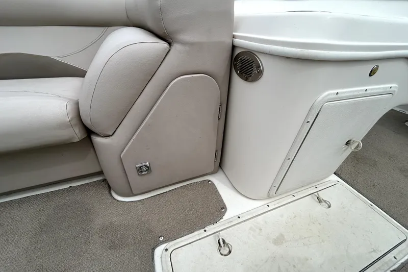 Slide: The Image of Interior of a 2014 Hurricane FunDeck 226F boat, featuring seating and storage compartments. - 16