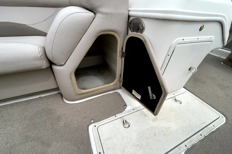 Slide: The Image of Interior view of a 2014 Hurricane FunDeck 226F boat, featuring seating and storage compartments. - 17