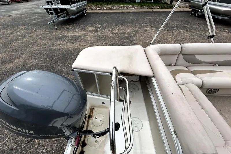 Slide: The Image of 2014 Hurricane FunDeck 226F boat interior with Yamaha motor, featuring spacious seating. - 21
