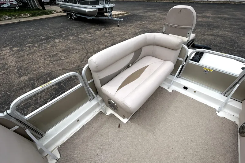 Slide: The Image of 2014 Hurricane FunDeck 226F boat interior with beige seating and carpeted floor. - 26