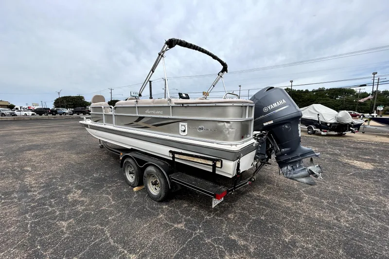 Slide: The Image of 2014 Hurricane FunDeck 226F boat on trailer with Yamaha outboard motor. - 5