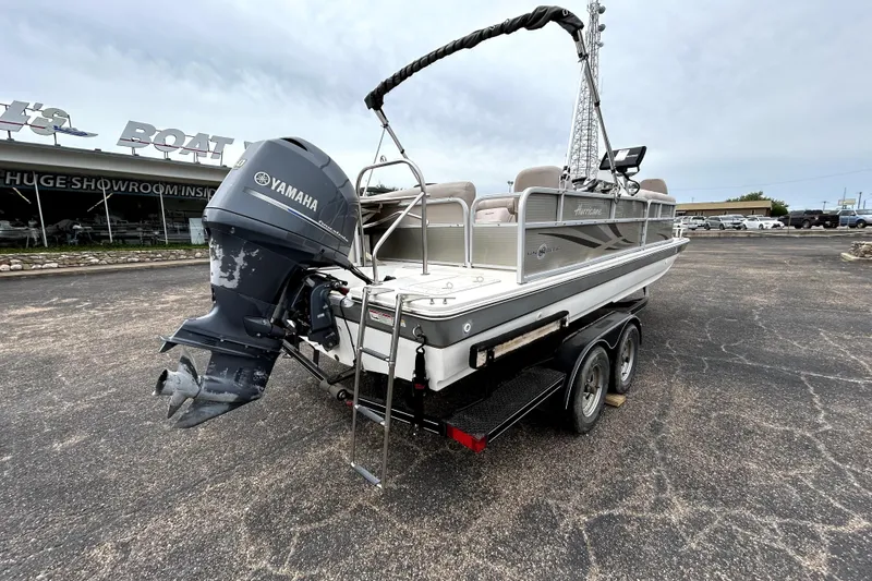 Slide: The Image of 2014 Hurricane FunDeck 226F boat with Yamaha outboard motor on trailer. - 7