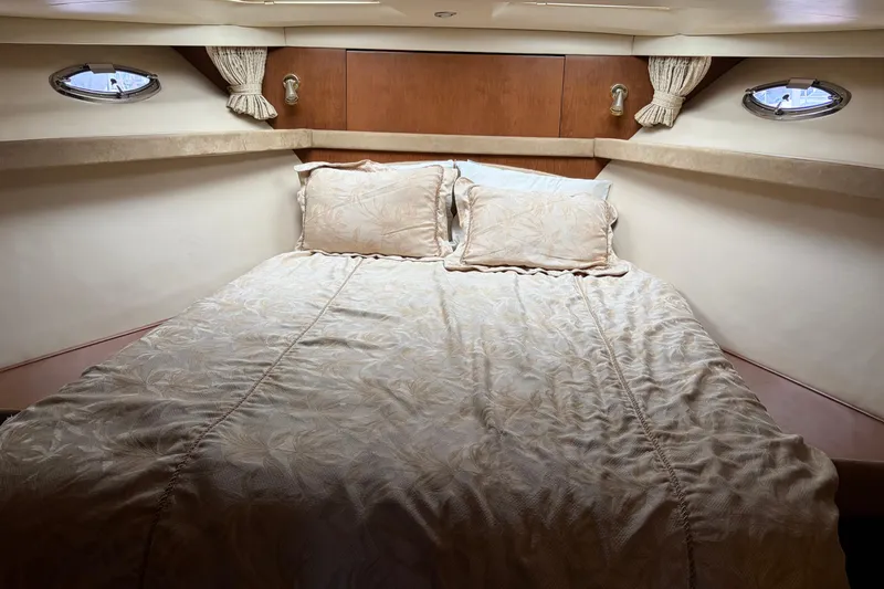 Slide: The Image of Luxurious cabin interior of 2005 Meridian 490 Pilothouse yacht with elegant bedding. - 12
