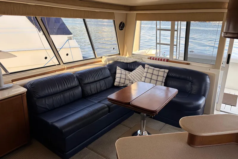 Slide: The Image of Luxurious interior of 2005 Meridian 490 Pilothouse with leather seating and waterfront view. - 5