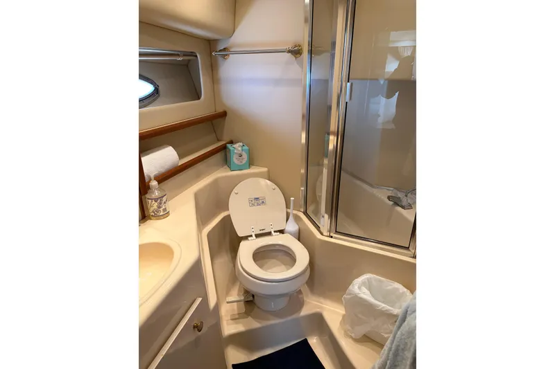 Slide: The Image of Bathroom in 2005 Meridian 490 Pilothouse yacht with toilet, sink, and shower. - 9