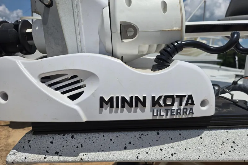 Slide: The Image of Minn Kota Ulterra motor on 2023 Xpress H22B Bay boat, close-up view. - 11