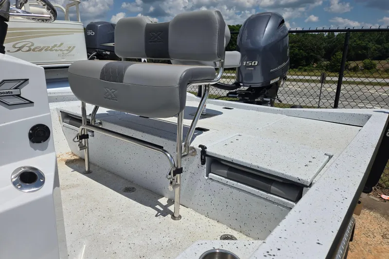 Slide: The Image of 2023 Xpress H22B Bay boat with dual seats and Yamaha 150 engine. - 14