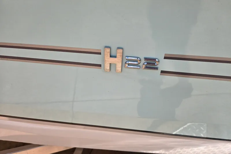Slide: The Image of 2023 Xpress H22B Bay boat emblem with sleek design accents. - 16