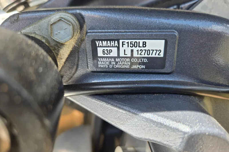 Slide: The Image of Close-up of Yamaha F150LB engine label on 2023 Xpress H22B Bay boat. - 17