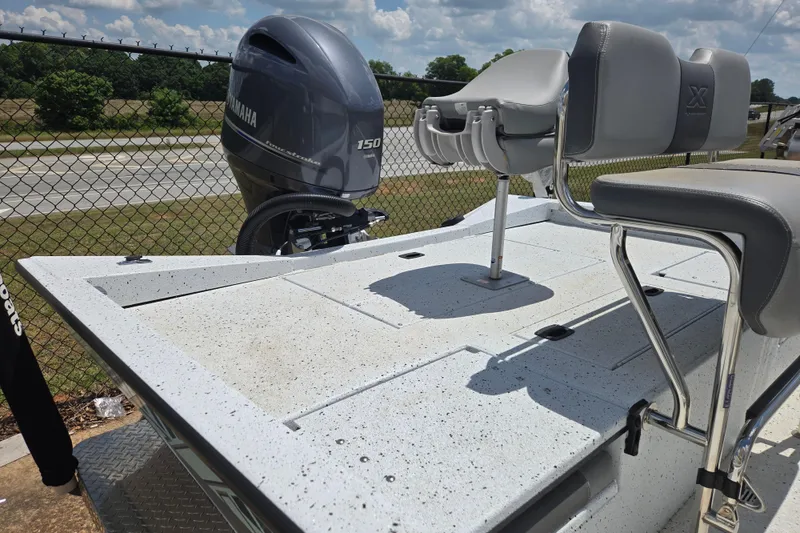 Slide: The Image of 2023 Xpress H22B Bay boat with Yamaha 150 engine, featuring sleek seating and spacious deck. - 7