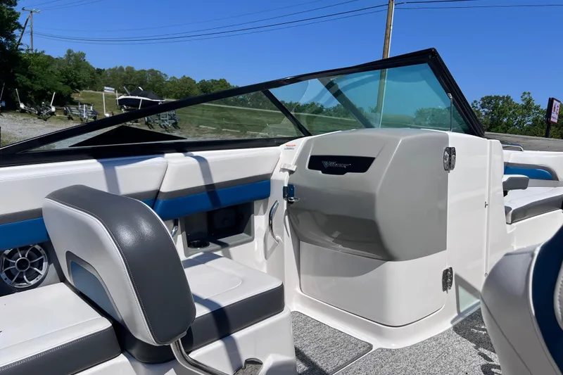 Slide: The Image of 2016 Chaparral Vortex 243 VRX boat interior with seating and dashboard view. - 12