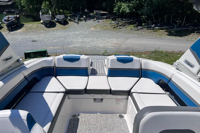 Slide: The Image of 2016 Chaparral Vortex 243 VRX boat interior with blue and white seating. - 13