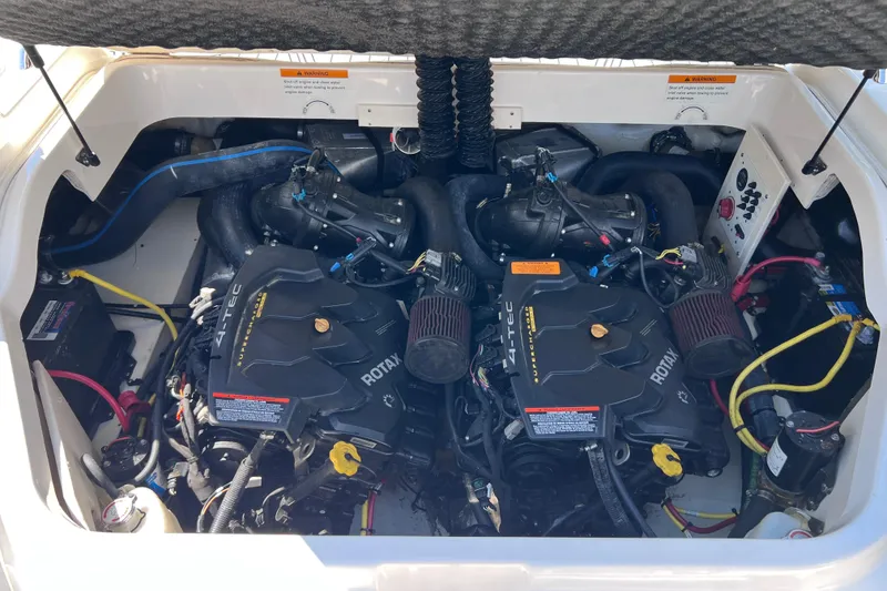 Slide: The Image of Engine compartment of a 2016 Chaparral Vortex 243 VRX boat, featuring dual Rotax engines. - 15