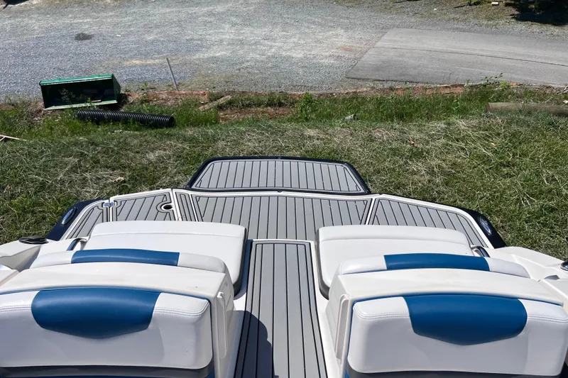Slide: The Image of 2016 Chaparral Vortex 243 VRX boat interior with blue and white seating. - 16