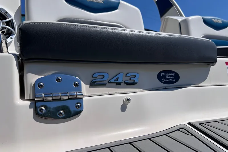 Slide: The Image of 2016 Chaparral Vortex 243 VRX boat detail with chrome hinge and logo. - 17