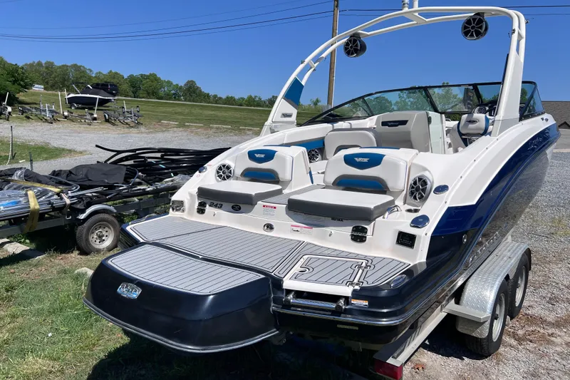Slide: The Image of 2016 Chaparral Vortex 243 VRX boat on trailer, featuring sleek design and spacious seating. - 2