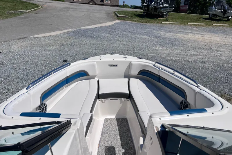 Slide: The Image of 2016 Chaparral Vortex 243 VRX boat interior with white and blue seating. - 5