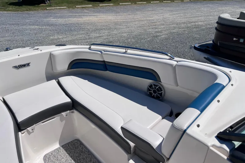 Slide: The Image of 2016 Chaparral Vortex 243 VRX boat interior with white and blue seating. - 6