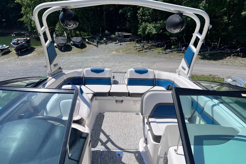 Slide: The Image of 2016 Chaparral Vortex 243 VRX boat interior with blue and white seating. - 7