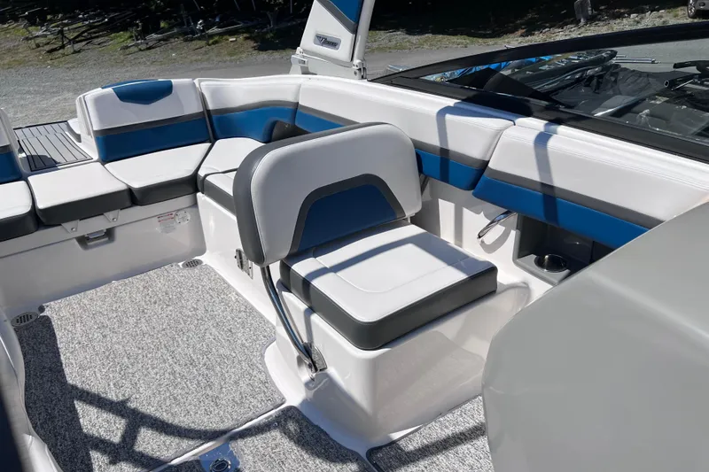 Slide: The Image of 2016 Chaparral Vortex 243 VRX boat interior with blue and white seating. - 8