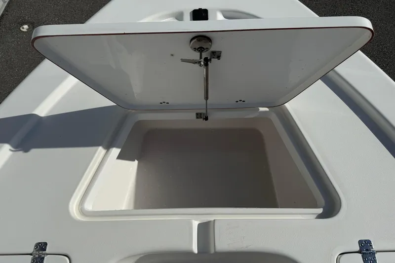 Slide: The Image of Open storage compartment on 2024 Sea Pro 210 Bay boat deck. - 10
