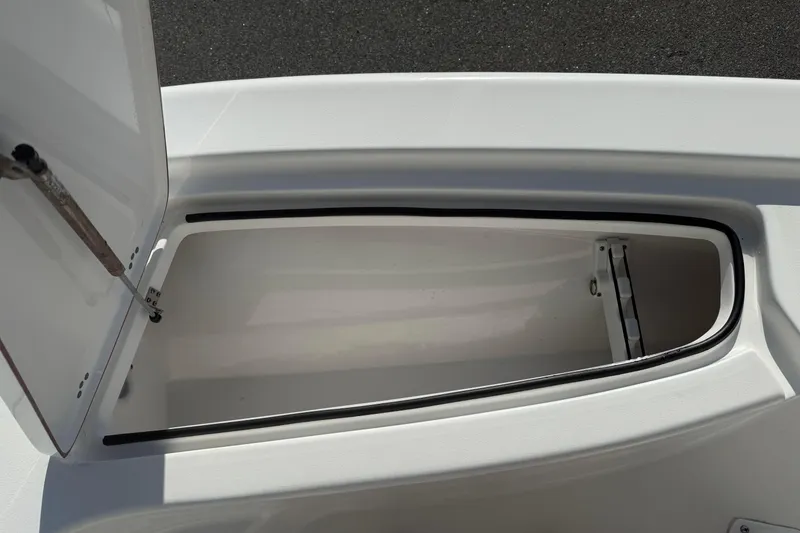 Slide: The Image of Open storage compartment on 2024 Sea Pro 210 Bay boat, showcasing interior space. - 11