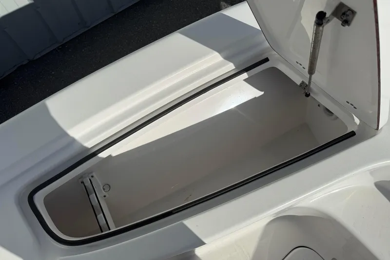Slide: The Image of Open storage compartment on a 2024 Sea Pro 210 Bay boat, showcasing interior space. - 12