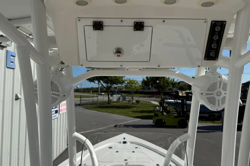 Slide: The Image of 2024 Sea Pro 210 Bay boat interior with speakers and storage compartment. - 17