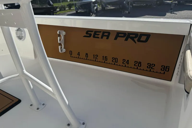 Slide: The Image of 2024 Sea Pro 210 Bay boat interior with measurement scale and branding. - 19