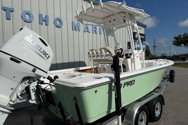 Slide: The Image of 2024 Sea Pro 210 Bay boat with Suzuki engine at Toho Marine dealership. - 2