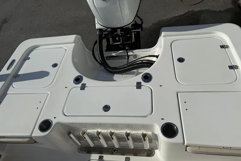 Slide: The Image of 2024 Sea Pro 210 Bay boat deck with storage compartments and motor mount. - 20