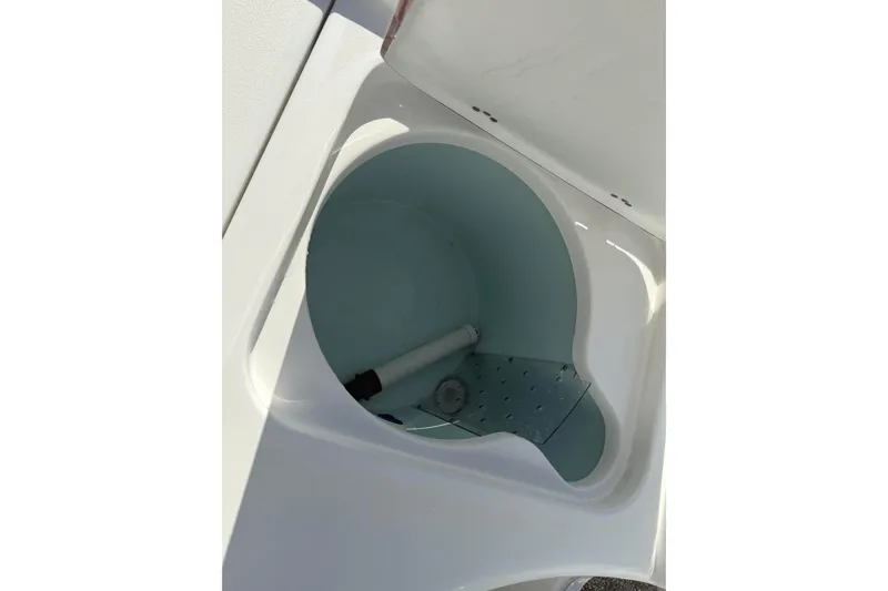 Slide: The Image of Livewell compartment in 2024 Sea Pro 210 Bay boat, showcasing interior design. - 23