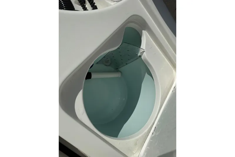 Slide: The Image of Livewell compartment of 2024 Sea Pro 210 Bay boat, showcasing interior design. - 24