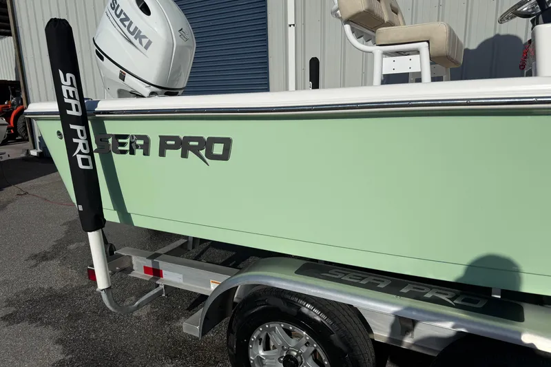 Slide: The Image of 2024 Sea Pro 210 Bay boat with Suzuki engine on trailer. - 3