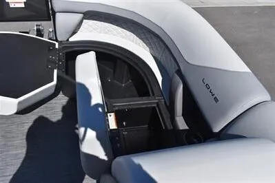 Slide: The Image of 2026 Lowe SF 212 Sport Fish boat interior with open storage compartment. - 15